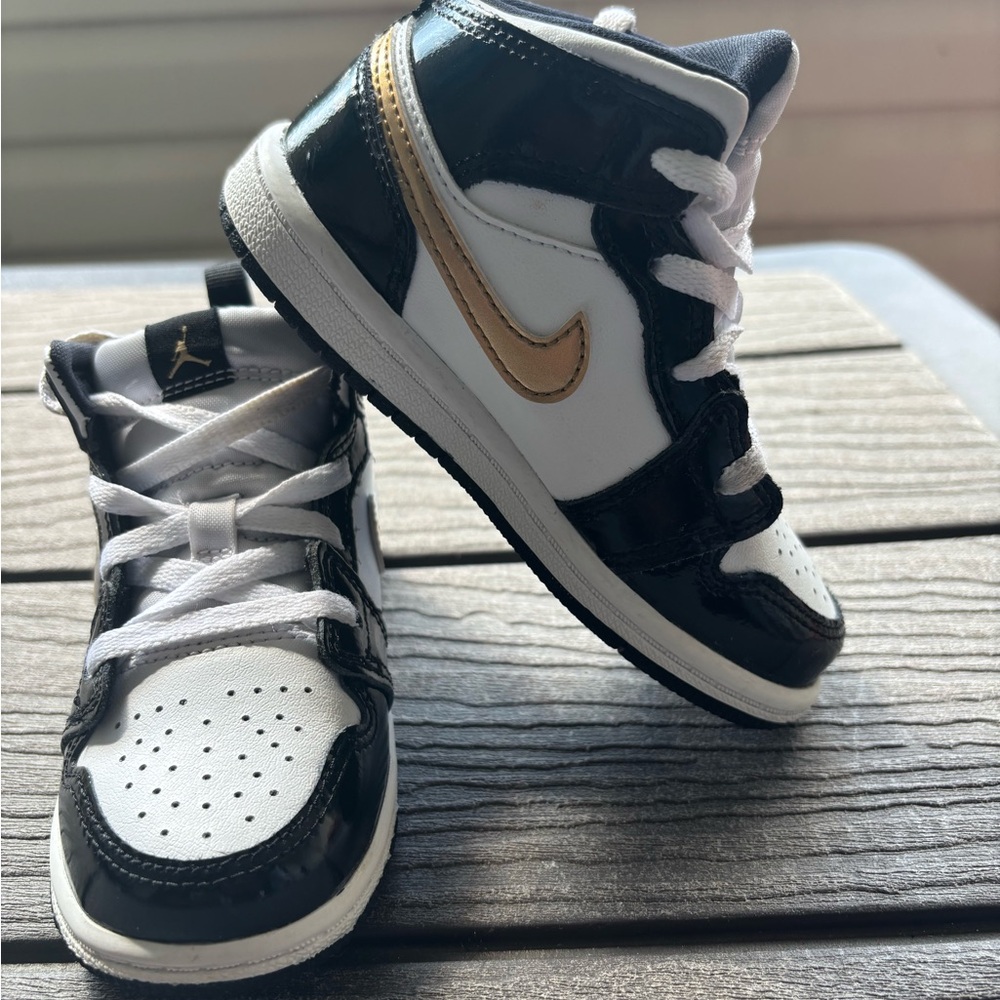 Jordan 1 Mid  Kids Black, White, and Gold Sneakers